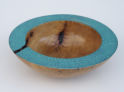 Turned wooden bowl textured and painted