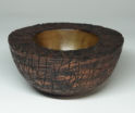 Turned wooden bowl carved, scorched and painted